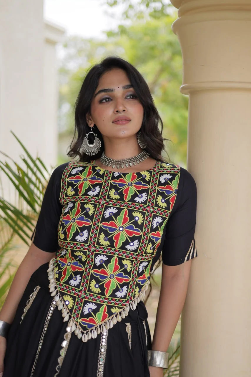 Black Kutchi mirror embroidered crop blouse with cowrie tassels, closeup