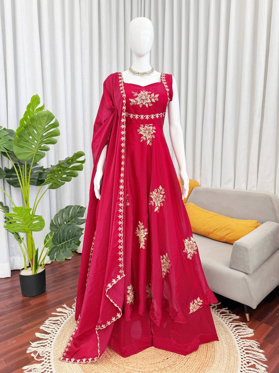 Close-up of red embroidered Anarkali palazzo set with gold floral design and dupatta