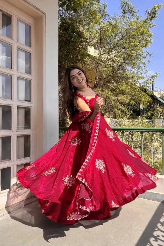 Model showcasing red Fendy silk embroidered Anarkali palazzo set with dupatta front view