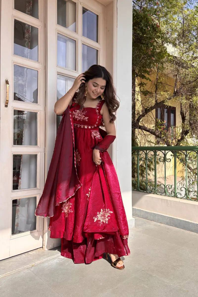 Red embroidered Anarkali palazzo set with dupatta twirl pose Indian wedding festive outfit