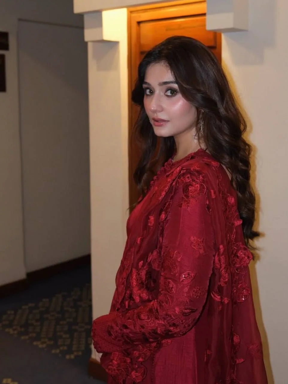 Red anarkali gown of anarkali suit set with sheer embroidered sleeves and micro cotton pant — front pose