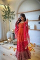 Red bandhani anarkali gown worn full length with red net dupatta – festive view