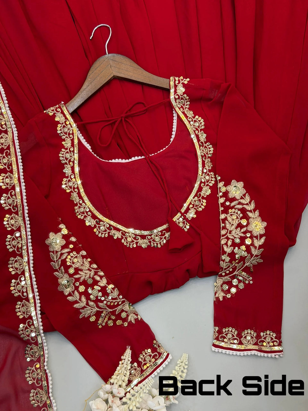 Red fox georgette gown back tie-up neckline and sleeve embroidery detail closeup