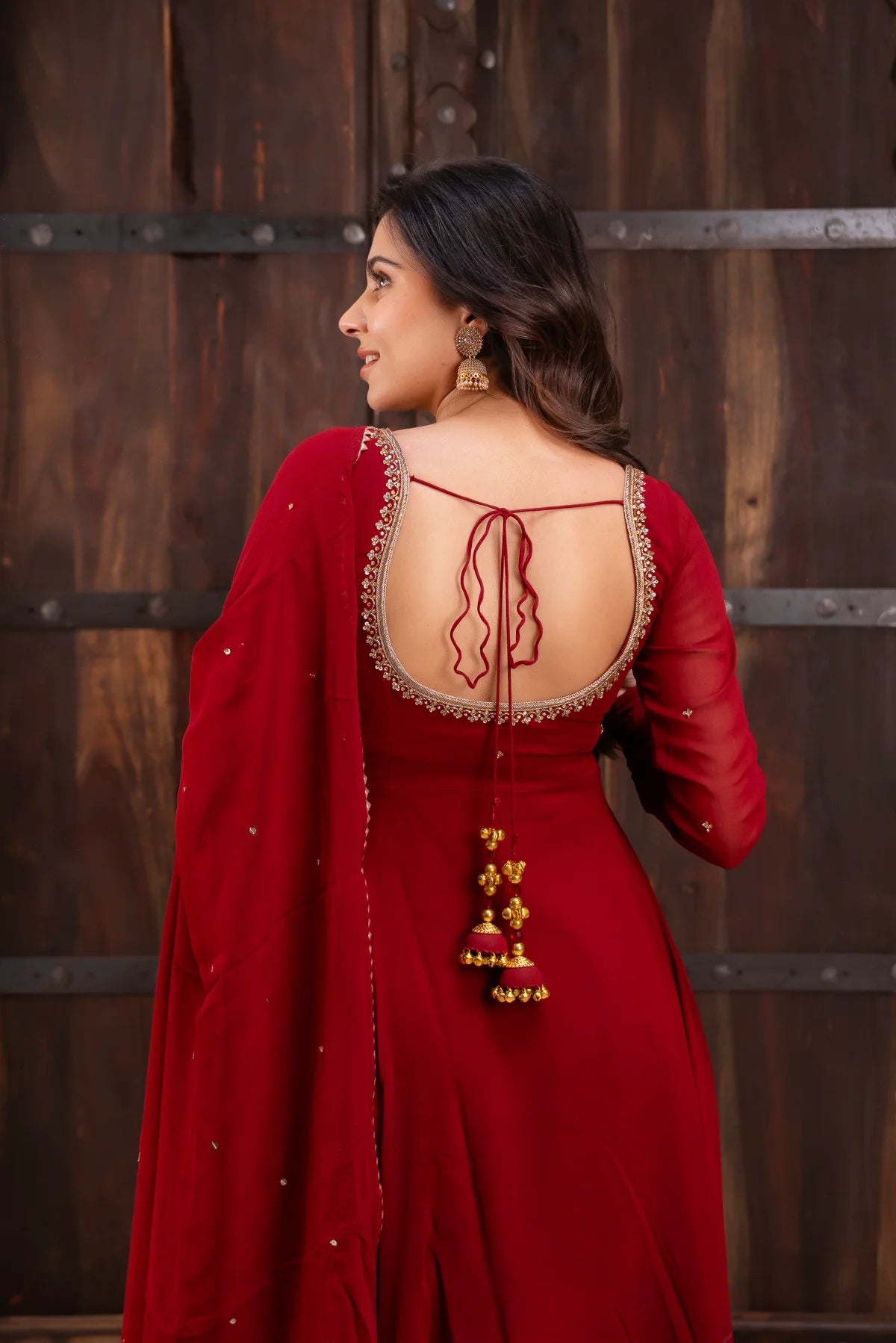 Red georgette anarkali suit front view with square neck and dense zari embroidery border