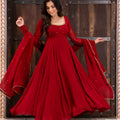 Open back with fabric tie and gold jhumka tassel on red anarkali suit – back view