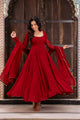 Open back with fabric tie and gold jhumka tassel on red anarkali suit – back view