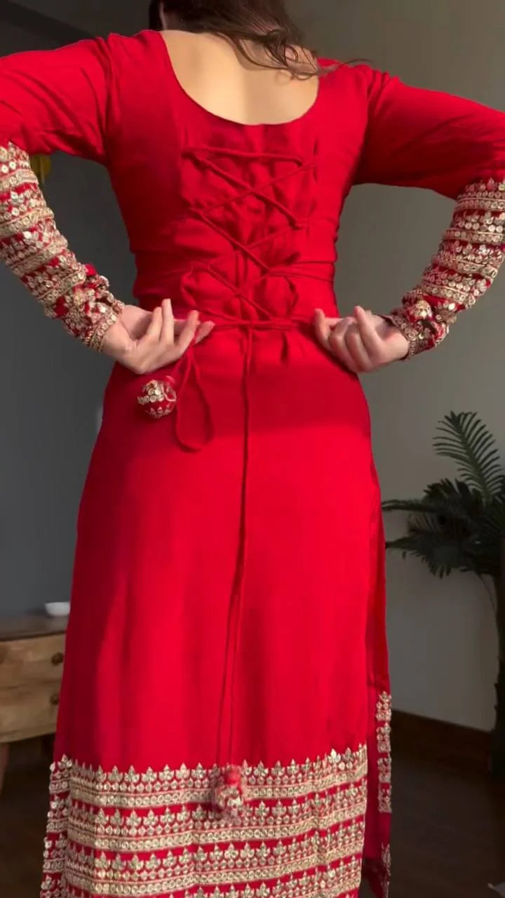 Red georgette kurta pant set – back view showing tie-up corset detail and embroidered hem