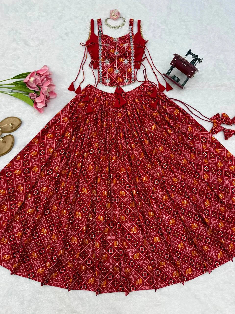 red navratri chaniya choli patola print flat lay mirror koti