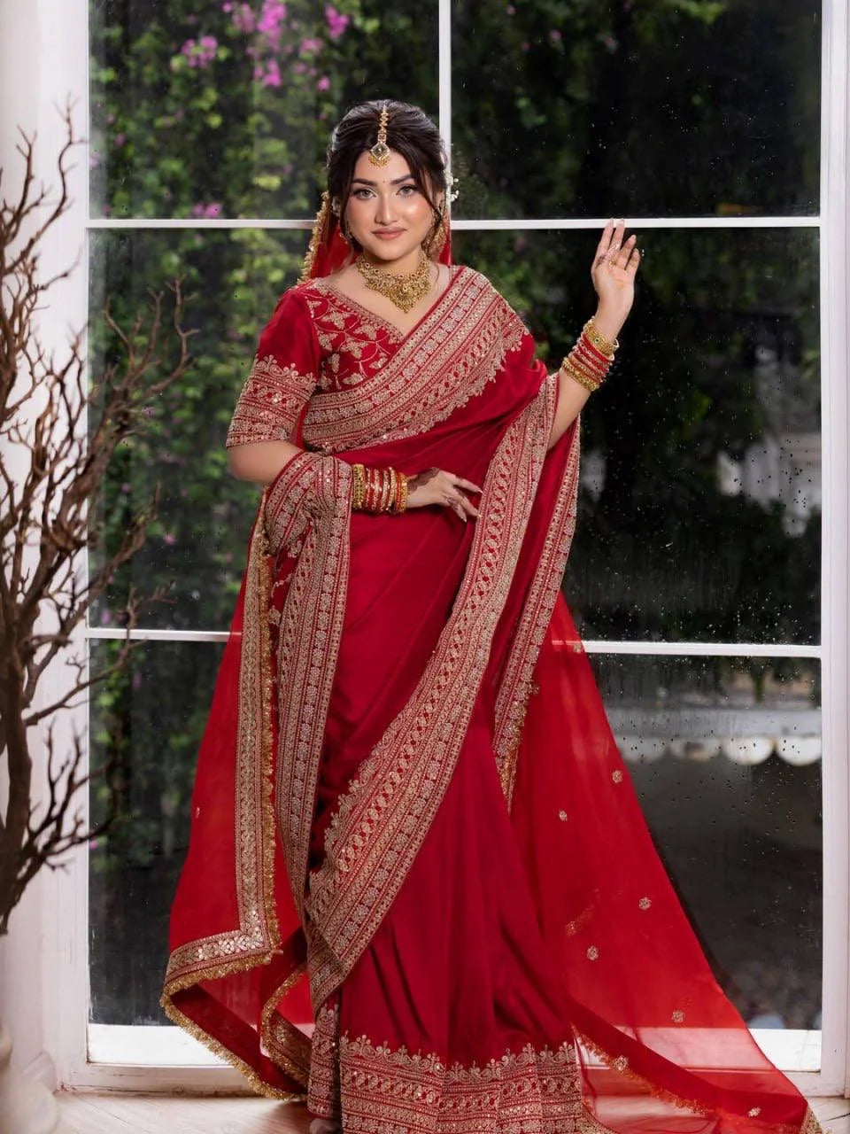 Red satin bridal saree full length view showing pallu and embroidered border