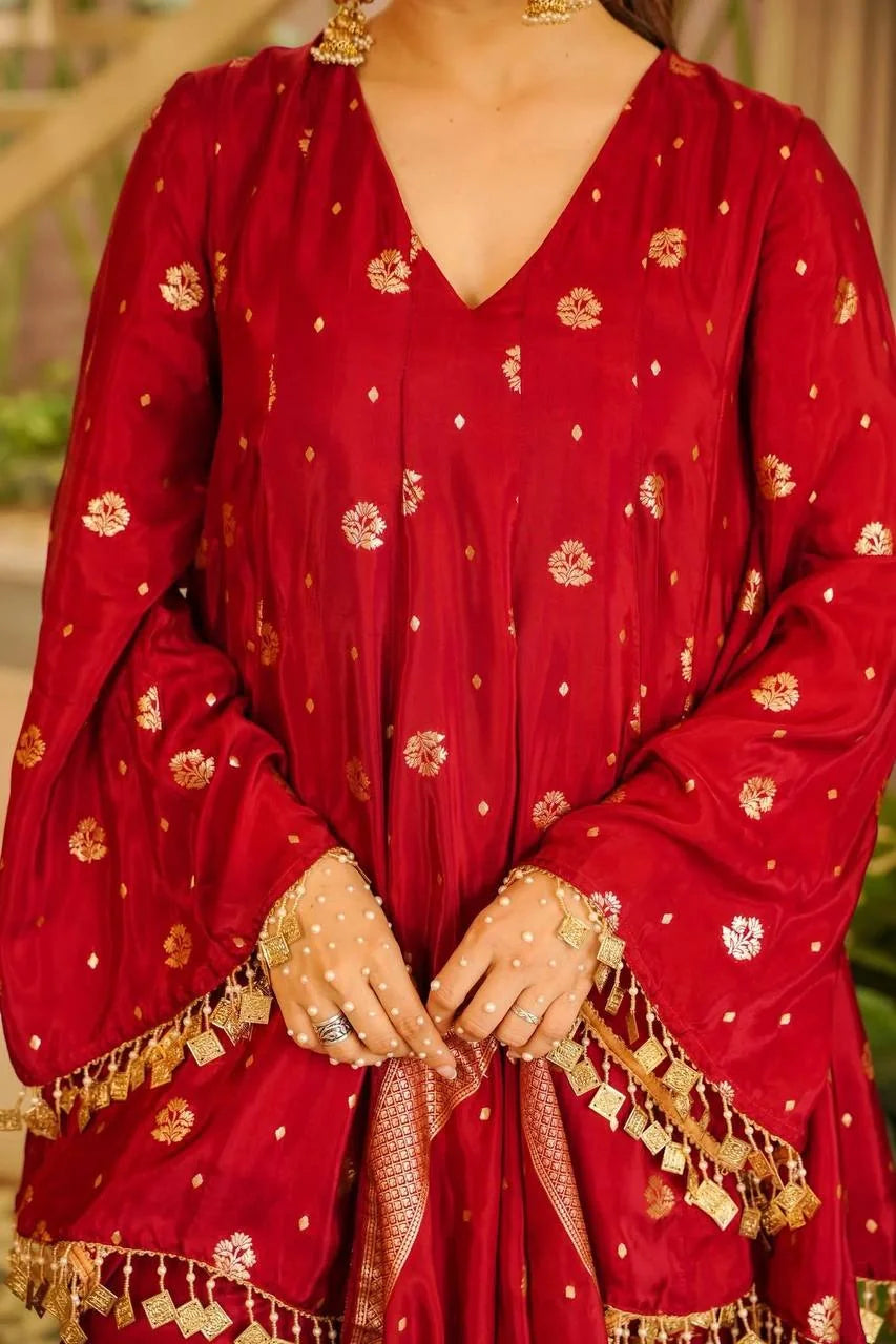 Close-up of red satin silk palazzo set top with woven gold butas and fancy coin lace