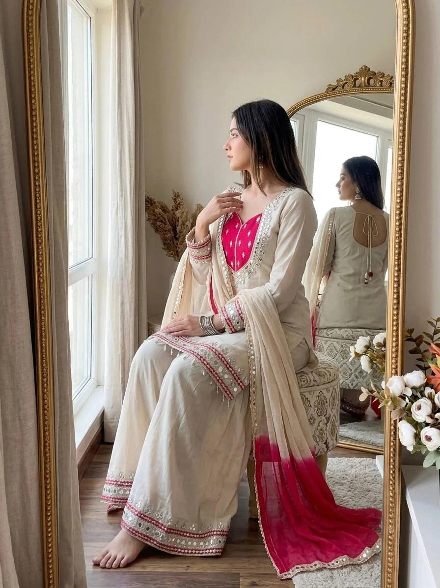 Roman glass palazzo suit cream colour with real mirror work – sitting pose