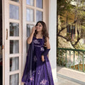 Woman wearing royal purple embroidered Fendy silk Anarkali palazzo set with dupatta outdoor festive look