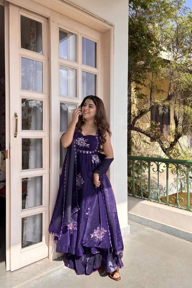 Woman wearing royal purple embroidered Fendy silk Anarkali palazzo set with dupatta outdoor festive look