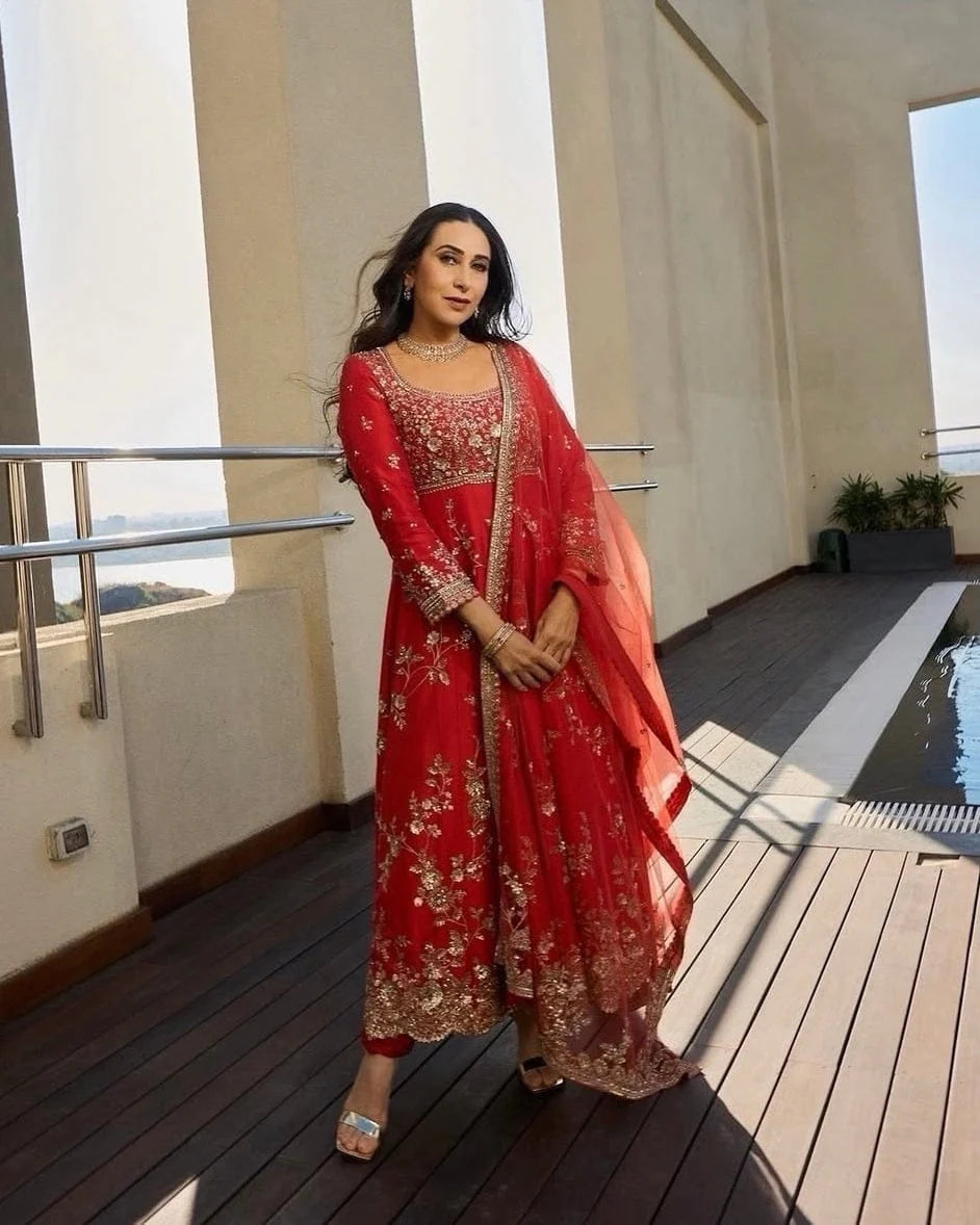 Front angle view of rust mulberry silk embroidered Anarkali set with elegant dupatta drape