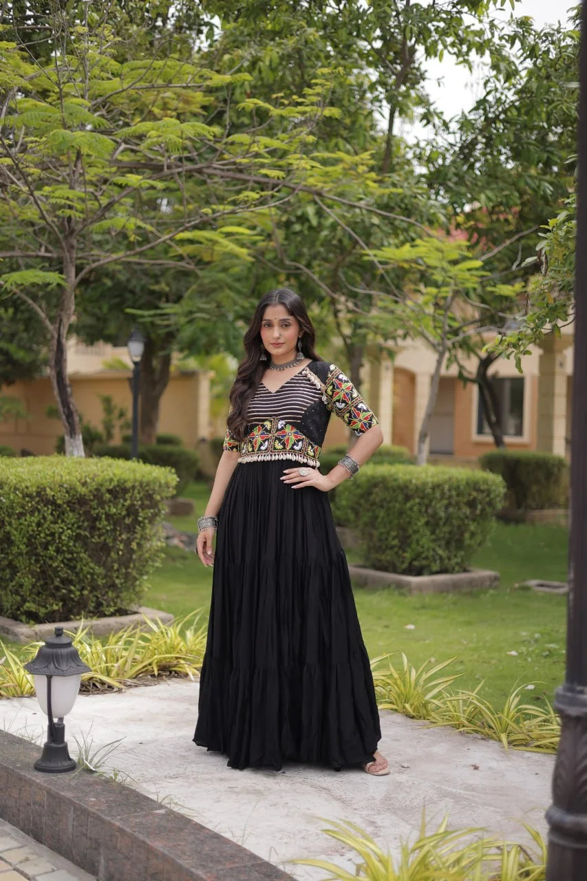Black navratri gown with Kutchi gamthi mirror sleeves and gota-stripe bodice, front view
