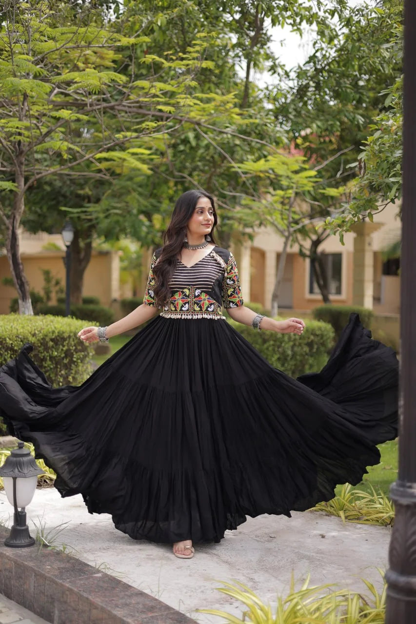 Black navratri gown twirl showing the twelve-metre tiered flair, dance view