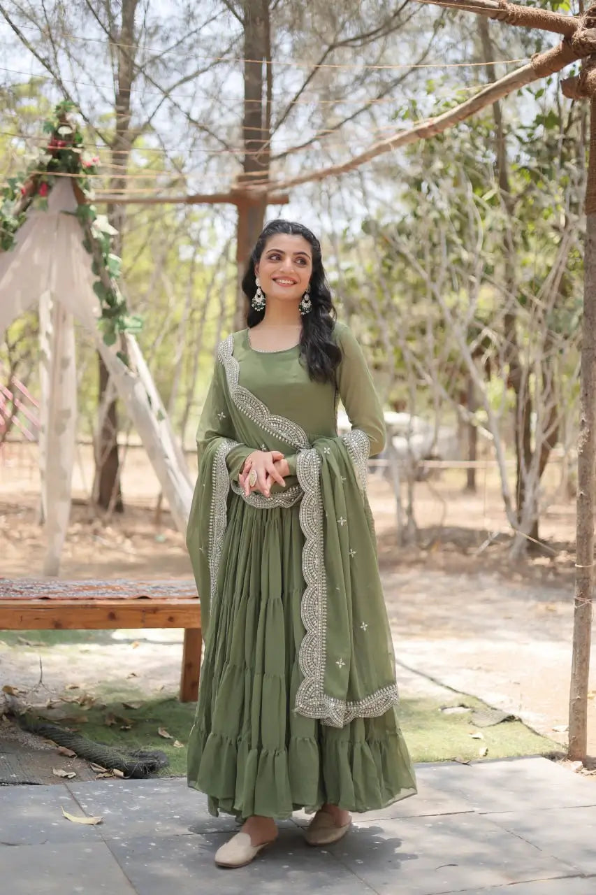 Sage green tiered frill anarkali gown with sequin embroidered dupatta – smiling model front view