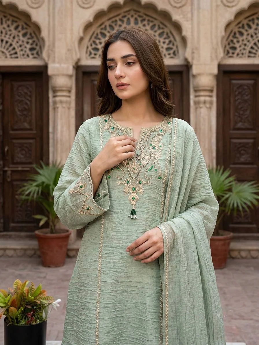 Sage green salsa silk sharara suit with coding and stone work and lace dupatta front view