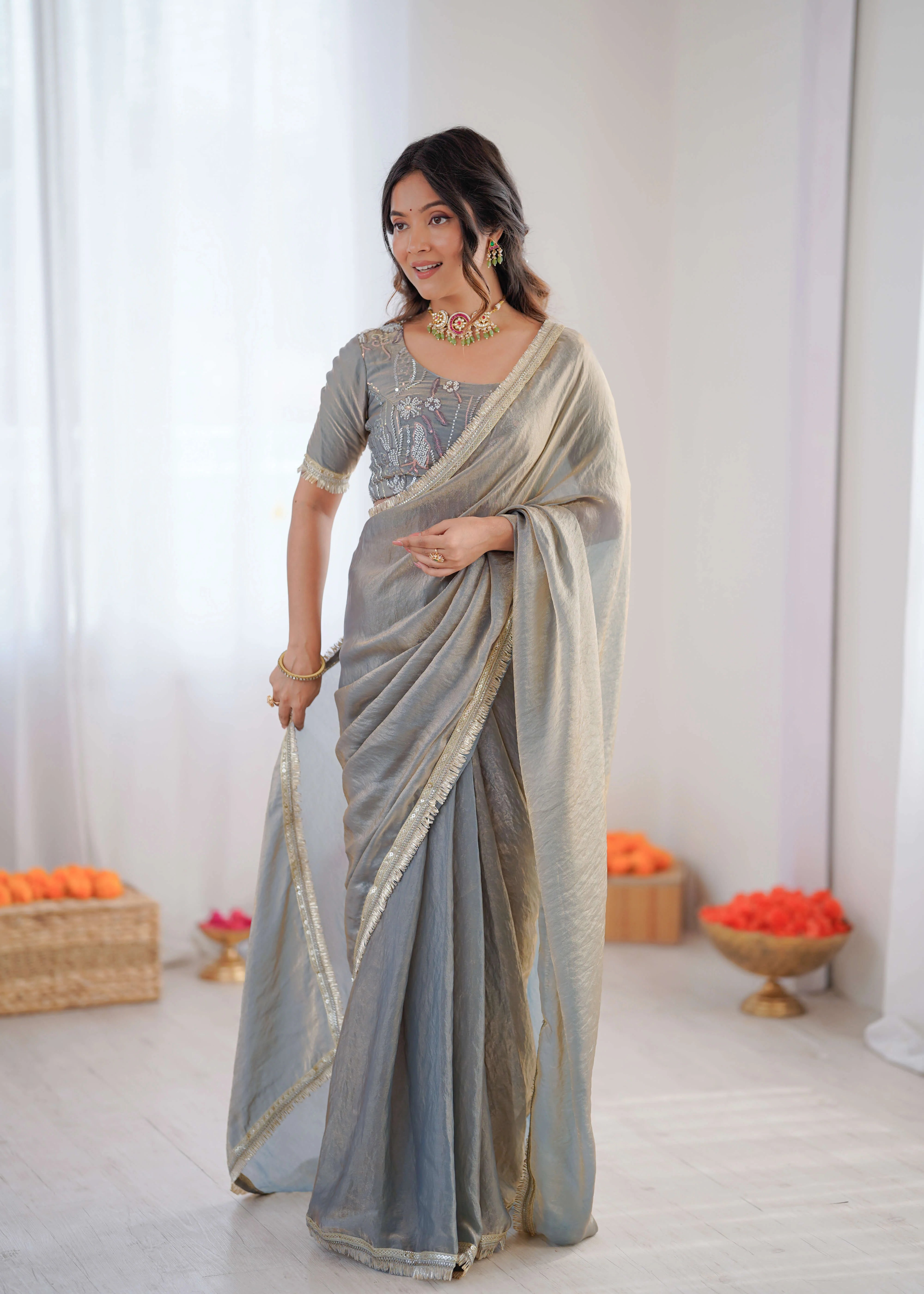 sage grey heavy georgette saree with embroidered blouse front standing view