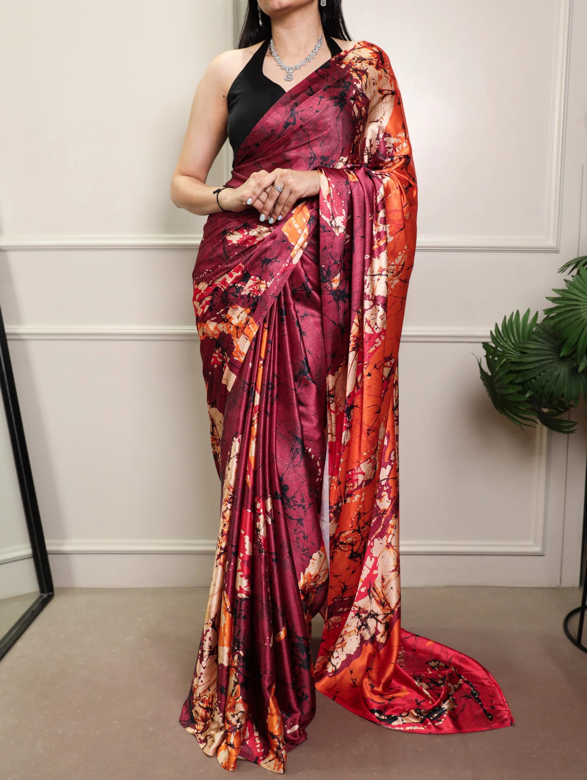 Maroon satin silk saree close-up – lustrous satin finish bold printed pattern