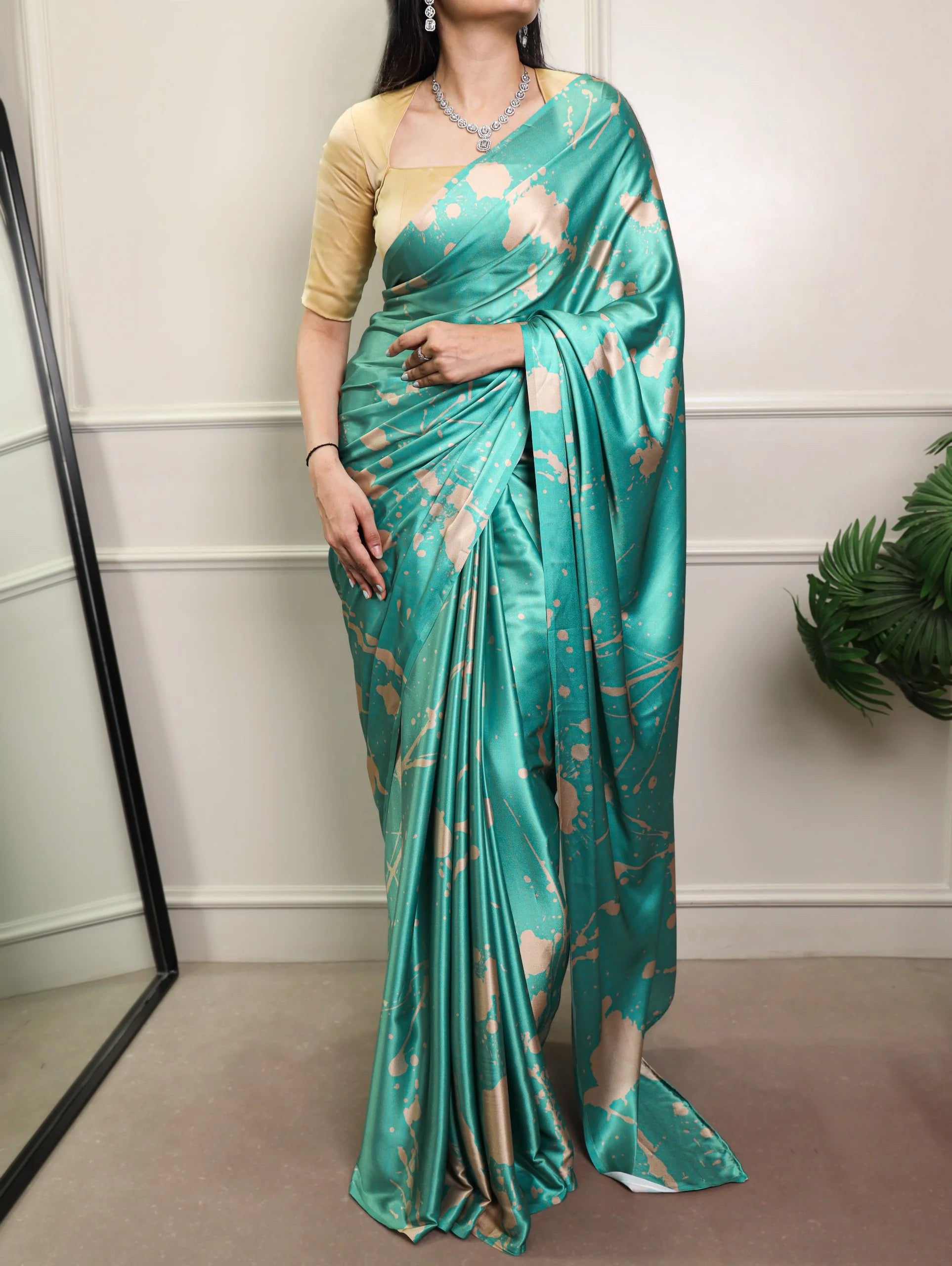 Peach satin silk saree – abstract leaf print on champagne satin fabric close-up