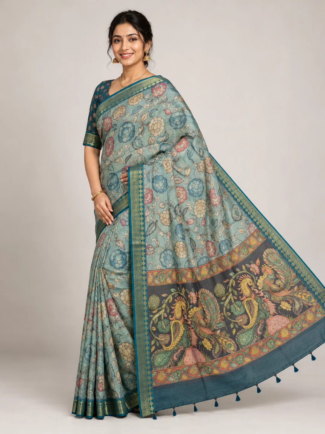 sea green kalamkari saree with floral print body and peacock pallu front pose
