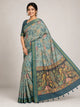 sea green kalamkari saree with floral print body and peacock pallu front pose
