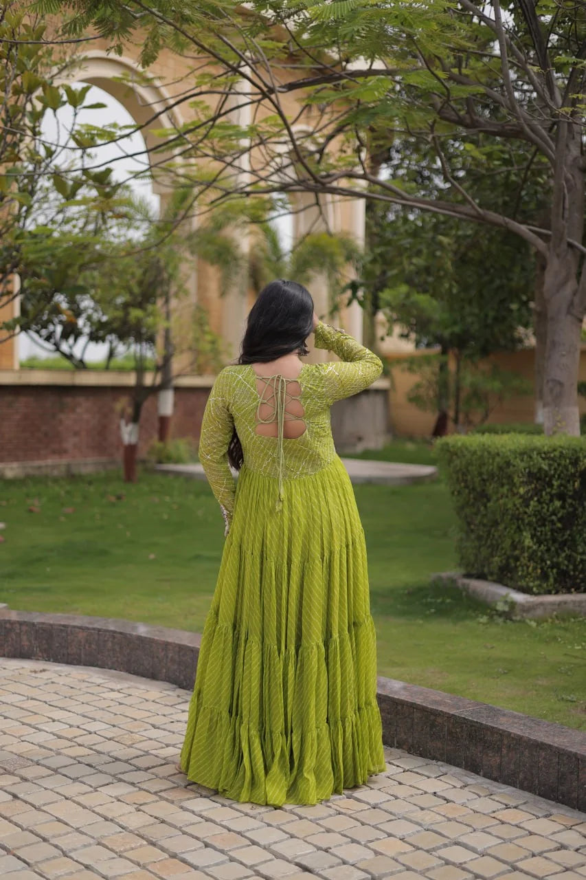 back view of mehndi green sequin leheriya gown with dori tassel
