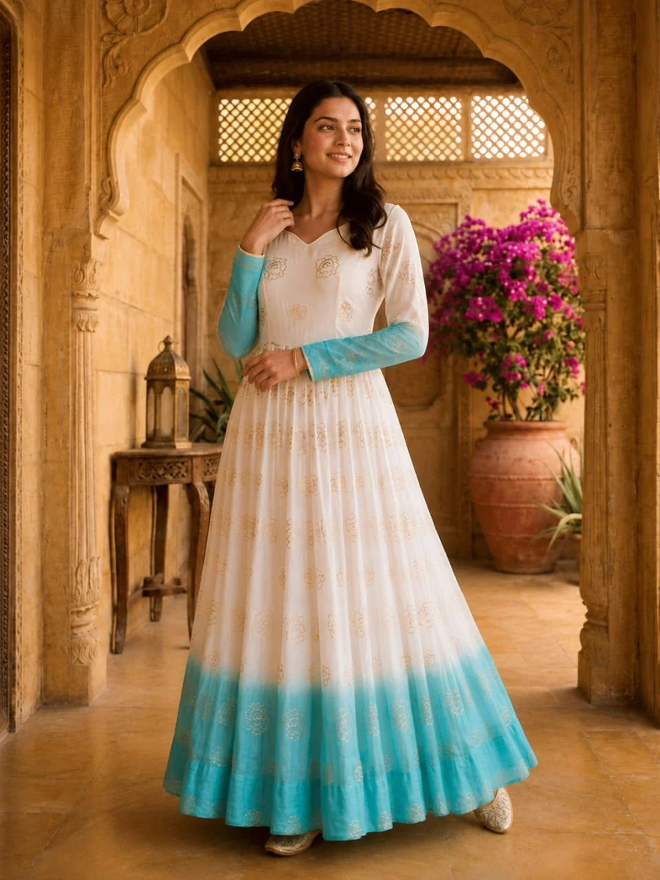 Shaded anarkali gown in sky blue – full-length front view with golden floral butas