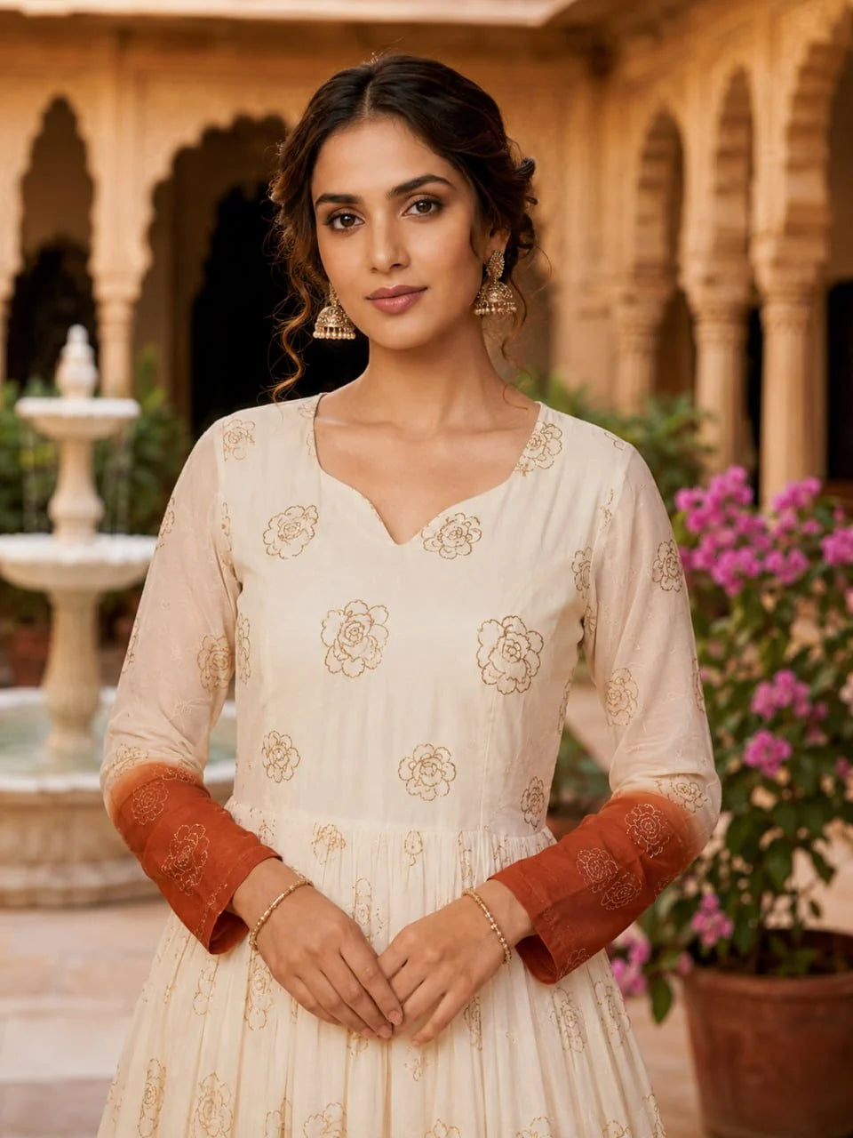 Crunchy shaded anarkali gown in sky blue – V-neck and golden sequin floral detail closeup