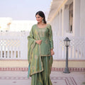 pista green sharara set with short kurti standing view