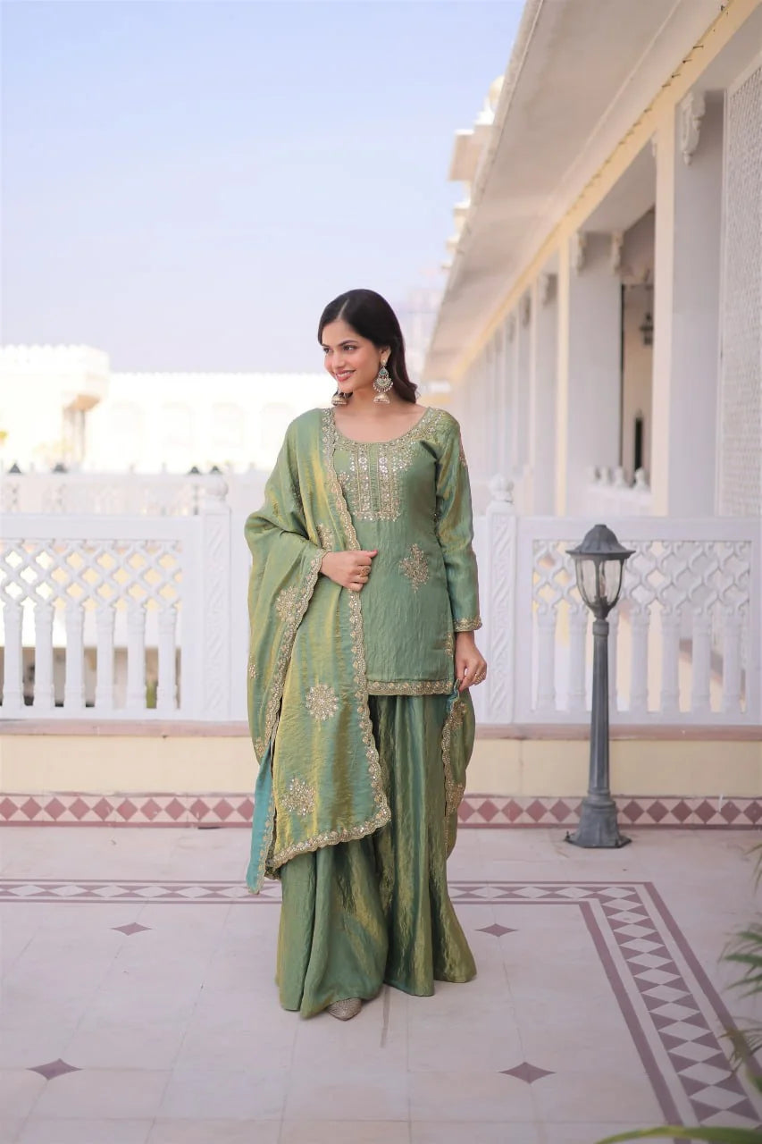 pista green sharara set with short kurti standing view