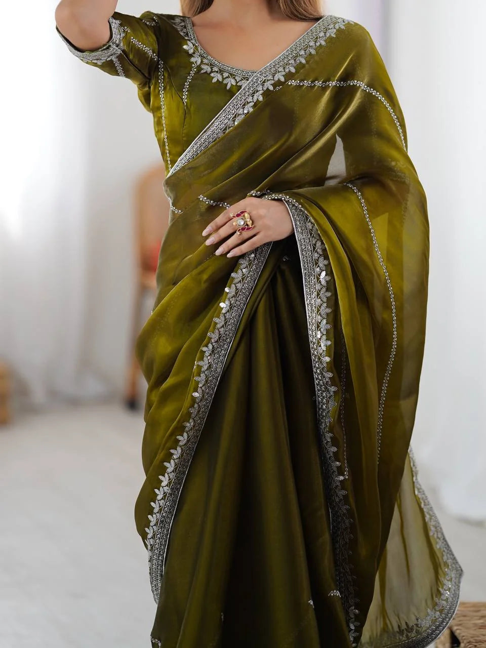 Olive green JMC silk saree back view — silver embroidered border and pallu drape