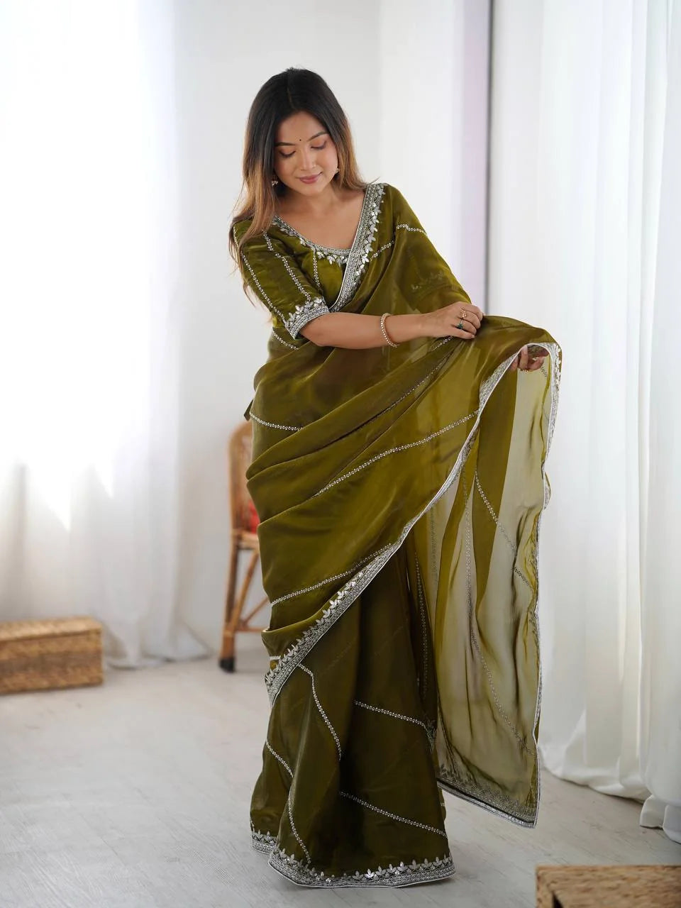 Heavy silk saree olive green — silver sequin work border detail close-up