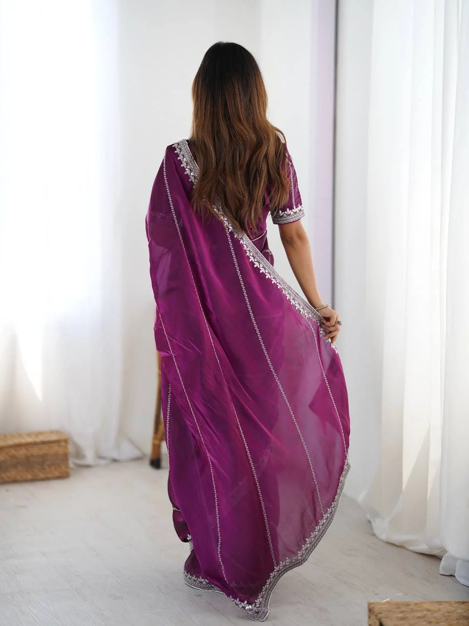 Purple silk saree with thread and sequin work — back view showing silver-embroidered border