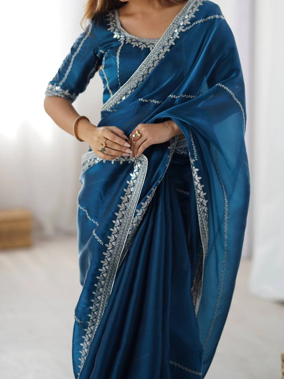 Teal blue JMC silk saree — silver sequin embroidery and thread border close-up