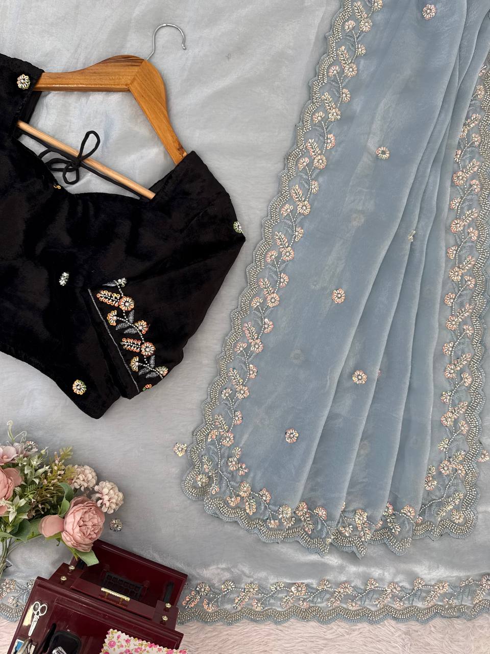 Detailed pallu design of sky blue embroidered saree with intricate bead and sequence works