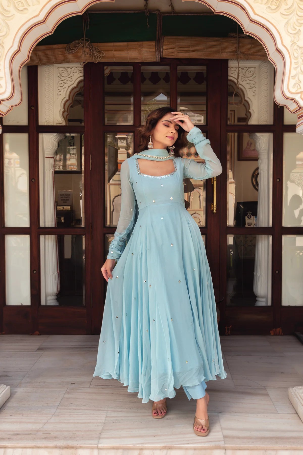 Sky blue georgette anarkali suit with mirror work and pearl border dupatta – front view