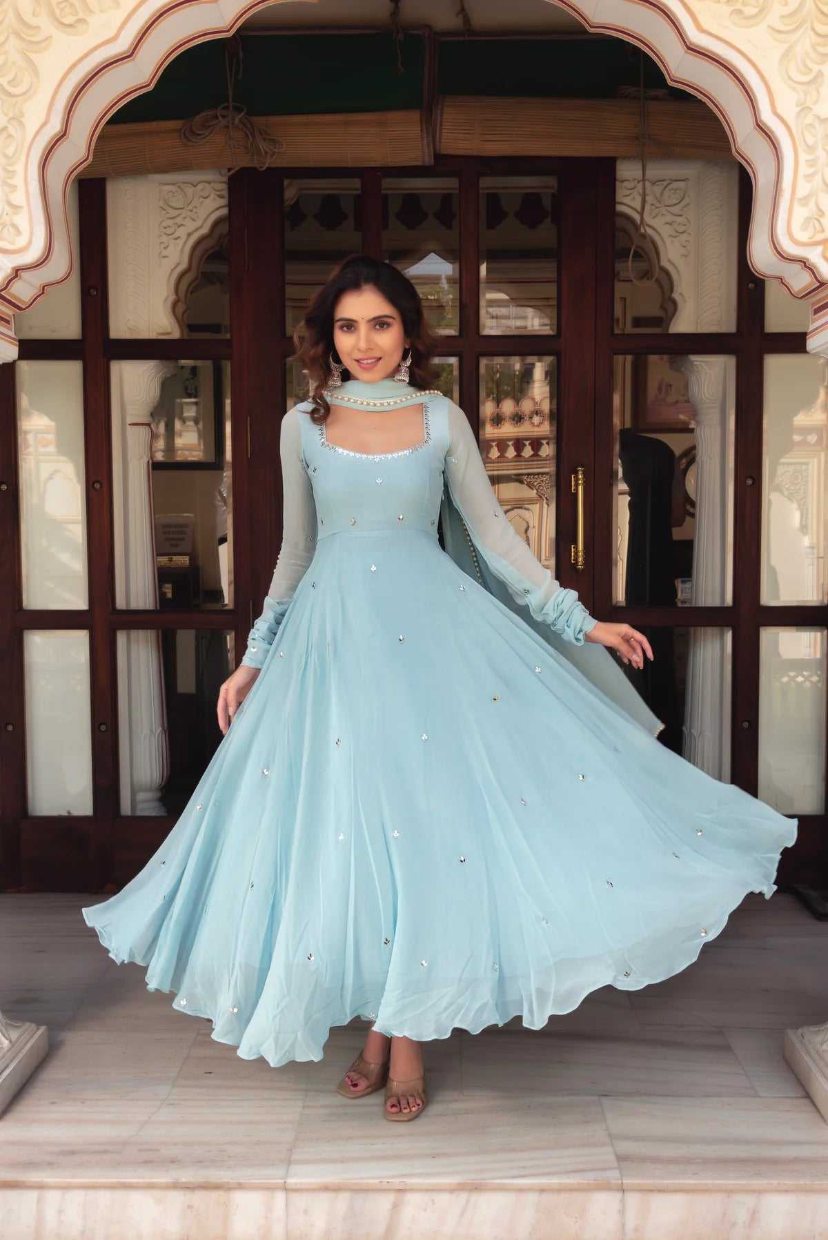 Full-length sky blue georgette anarkali suit with scattered mirror work butas – flare view