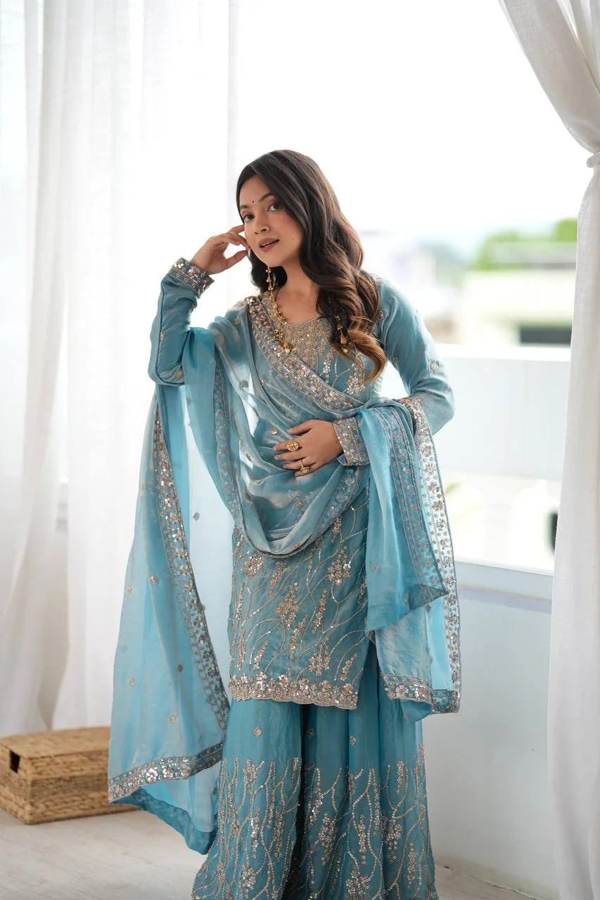 Teal blue fendy silk sharara set with dupatta draped – festive portrait view