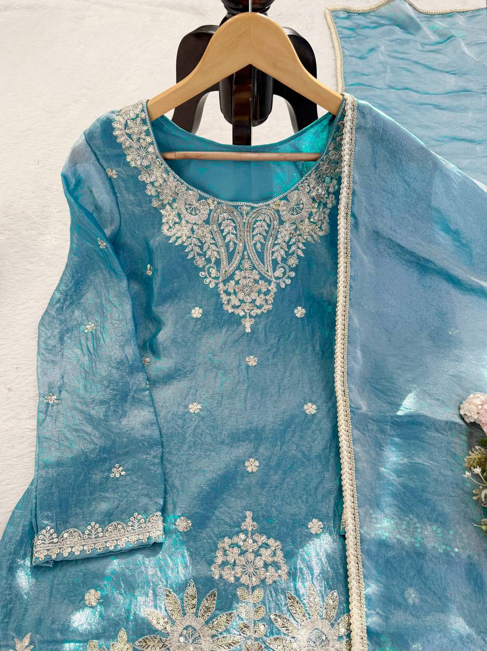 Teal kurta fabric close up with embroidery and texture detail for designer ethnic wear
