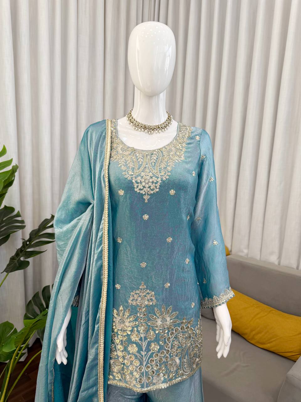 Side view of teal kurta palazzo set with dupatta and detailed embroidery design
