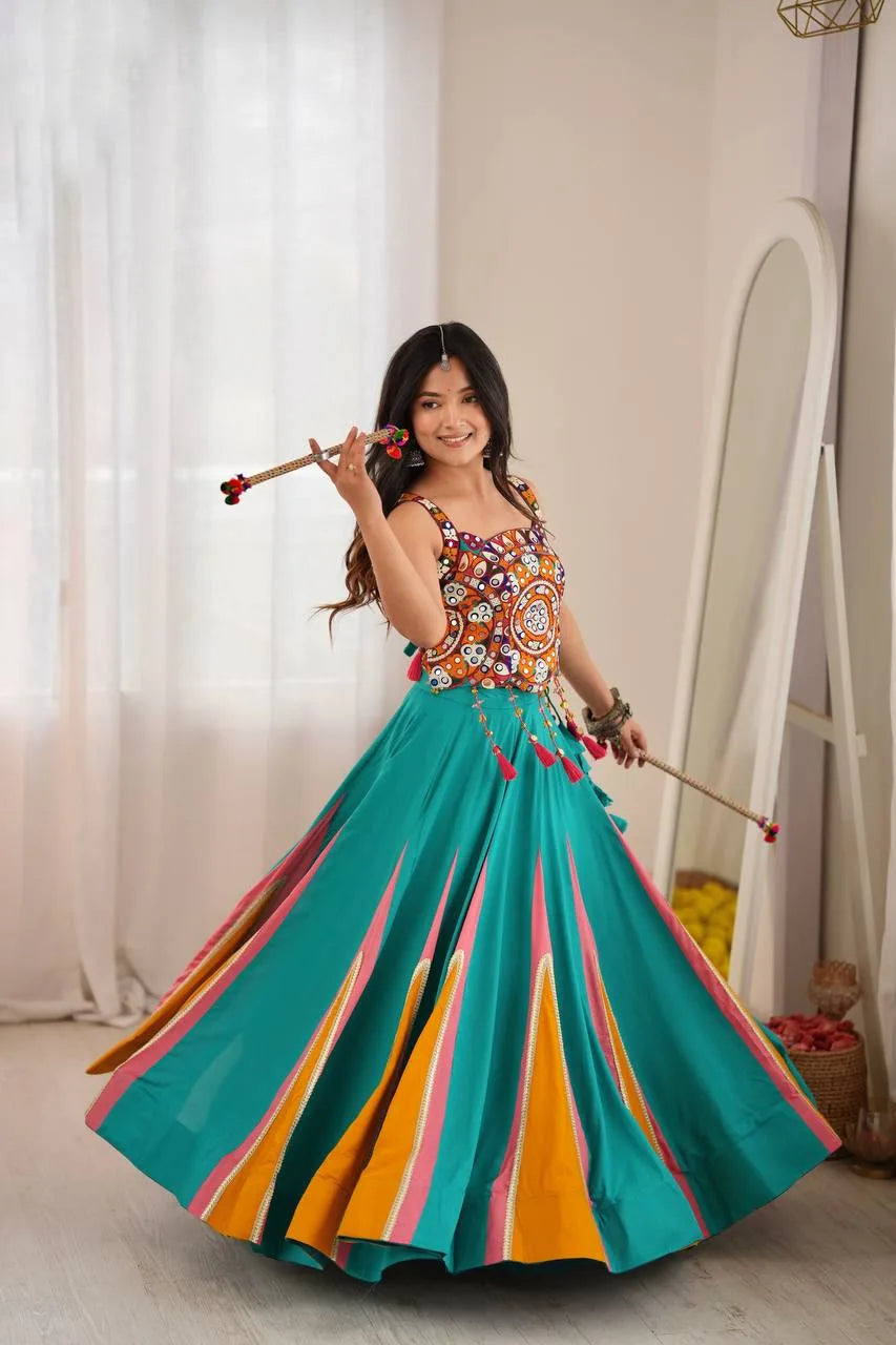 Full teal navratri chaniya choli with multicolour Kutchi mirror-work choli and rama-green kali flair — front view
