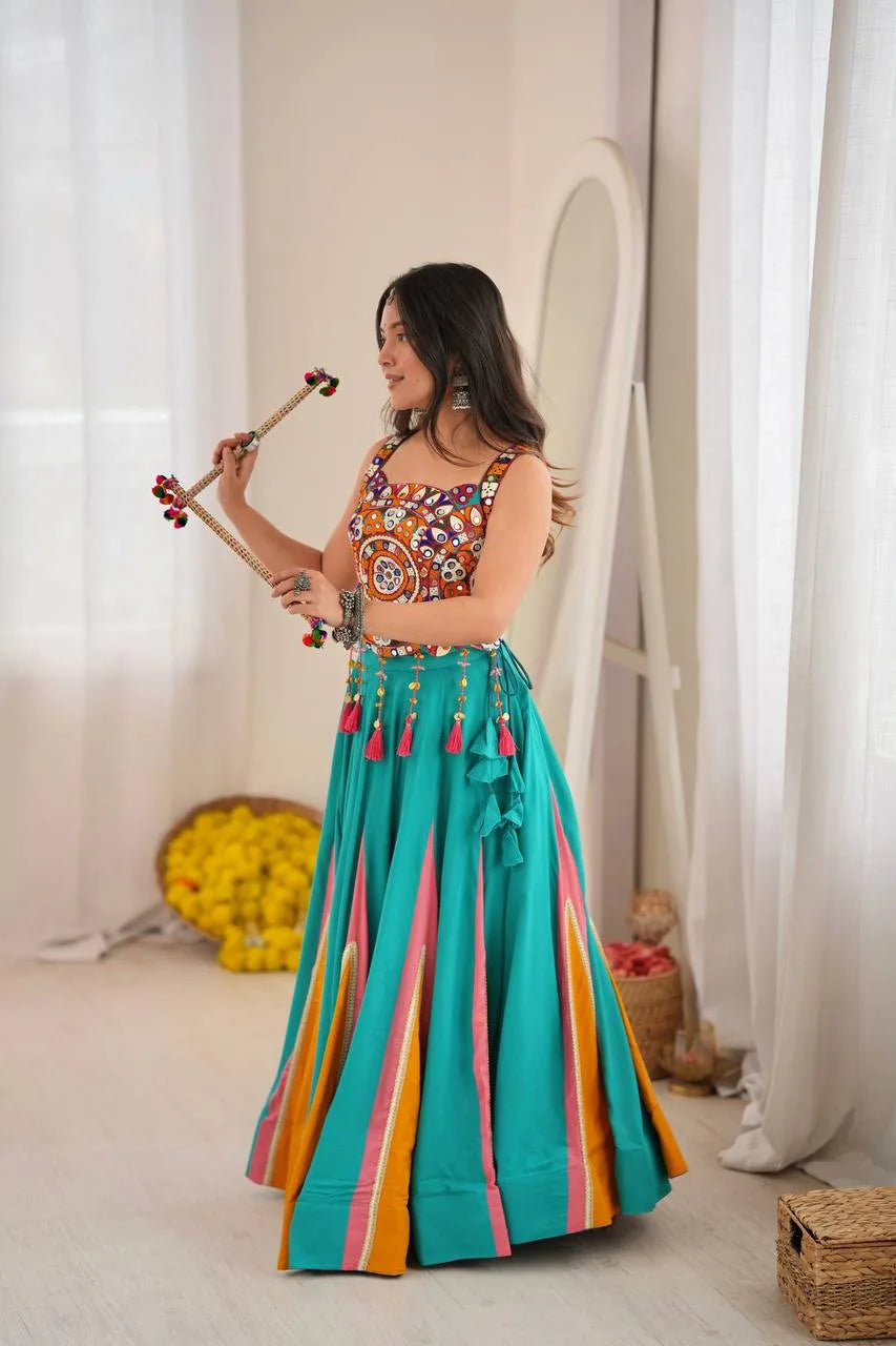 Teal navratri chaniya choli with gold lagdi patta lace kali gores and latkan tassels — side view
