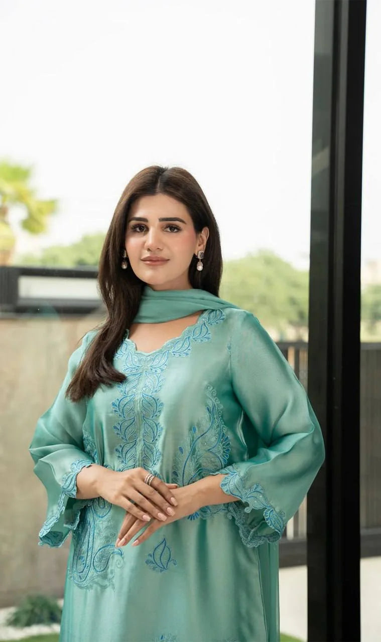 Teal rayon kurta set portrait showing V-neck and intricate thread embroidery panel