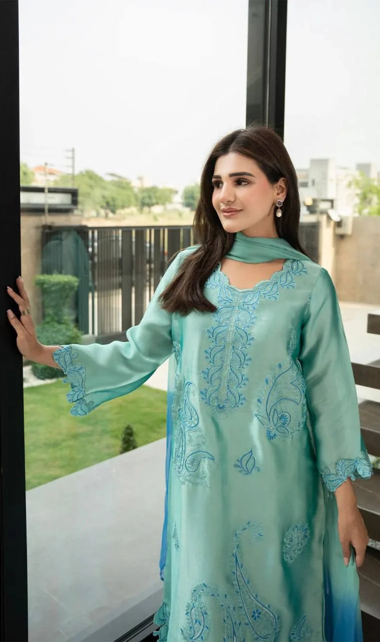 Teal rayon kurta set side view showing paisley thread embroidery and scalloped hem