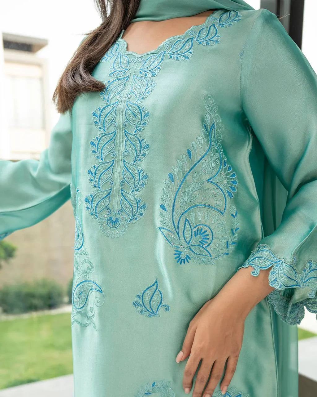 Close-up of teal rayon kurta set thread embroidery – floral and paisley motifs