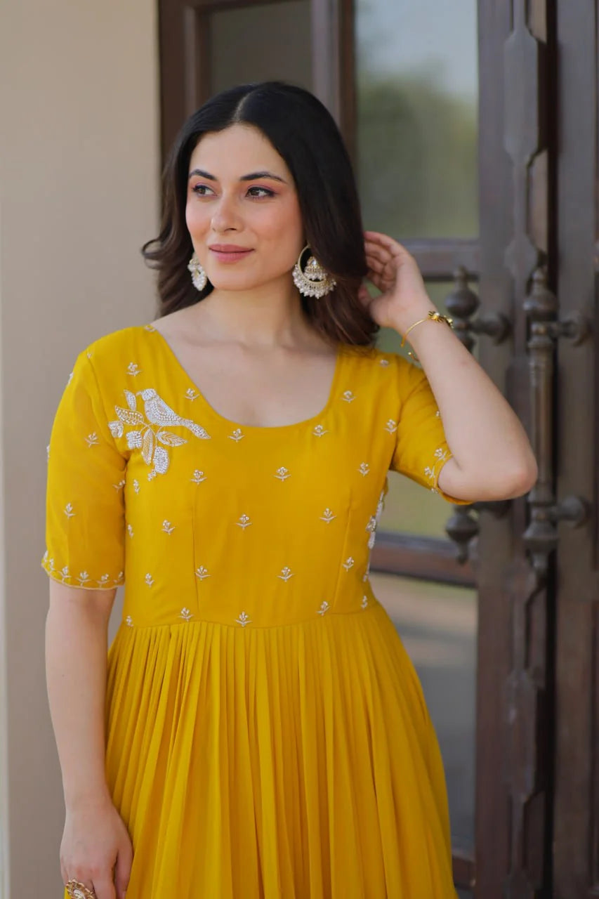 mustard tiered gown bird thread yoke closeup