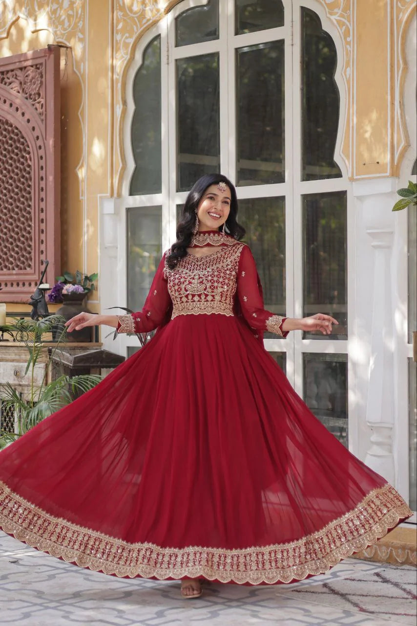maroon embroidered gown with dupatta smiling twirl view