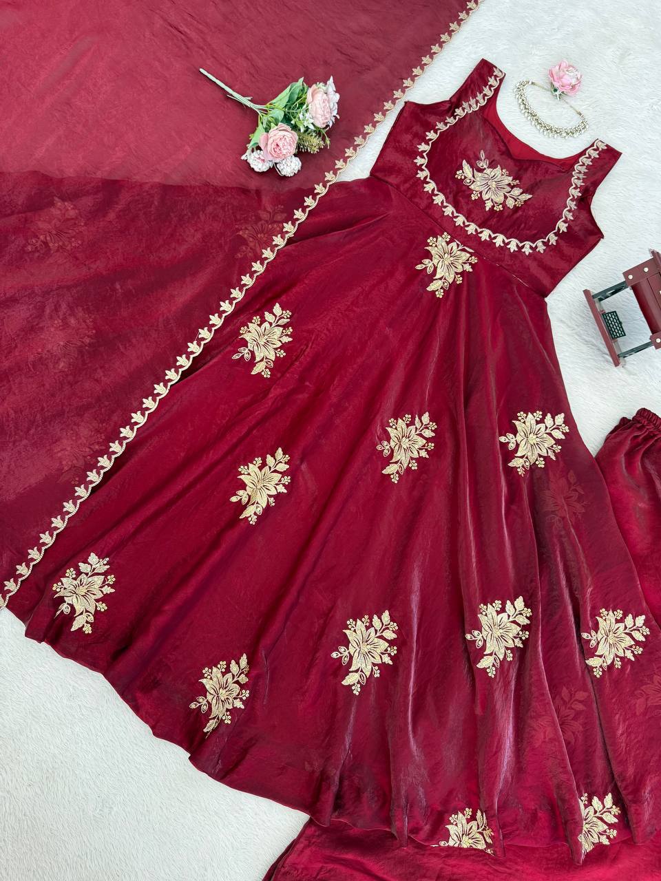 Flat lay of wine embroidered Fendy silk Anarkali palazzo set with dupatta showing fabric and design details